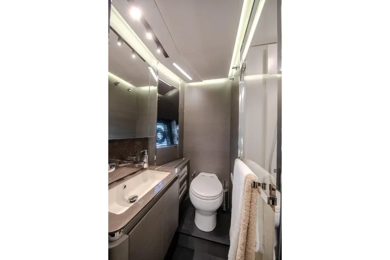  Yacht Photos Pics Luxurious bathroom in 2023 Azimut S8 yacht with modern fixtures and elegant design.