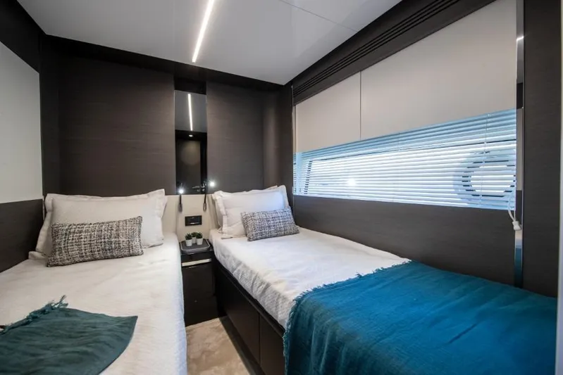  Yacht Photos Pics Luxurious twin cabin interior of 2023 Azimut S8 yacht with modern design and cozy bedding.