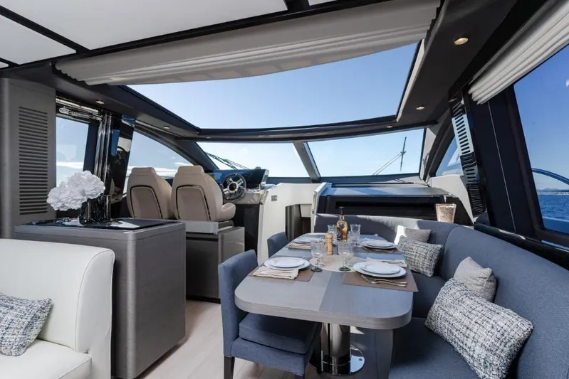  Yacht Photos Pics Luxurious interior of 2023 Azimut S8 yacht with elegant dining area and panoramic windows.