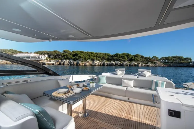  Yacht Photos Pics Luxurious 2023 Azimut S8 yacht deck with elegant seating and ocean view.