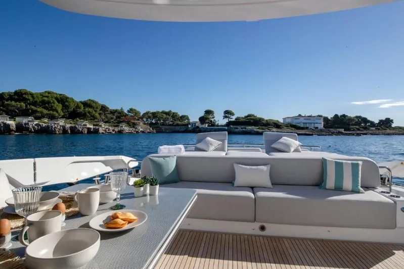  Yacht Photos Pics Luxurious 2023 Azimut S8 yacht deck with elegant seating and ocean view.