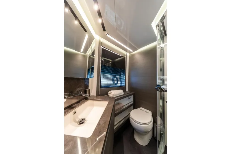  Yacht Photos Pics Luxurious bathroom interior of 2023 Azimut S8 yacht with modern fixtures and elegant design.