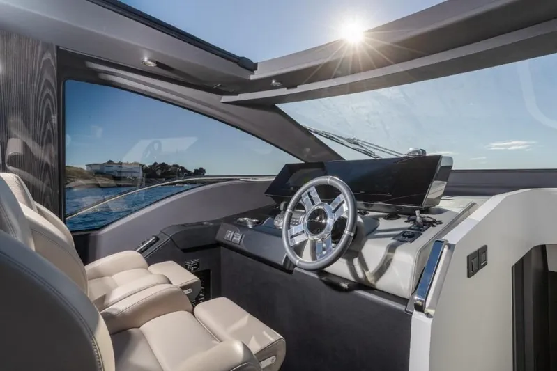  Yacht Photos Pics Luxurious 2023 Azimut S8 yacht cockpit with modern steering and panoramic view.