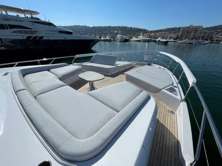  Yacht Photos Pics Luxurious 2023 Azimut S8 yacht deck with plush seating and scenic marina view.