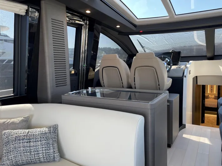  Yacht Photos Pics Luxurious interior of 2023 Azimut S8 yacht with modern seating and panoramic windows.