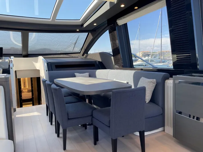  Yacht Photos Pics Luxurious interior of 2023 Azimut S8 yacht with elegant dining area and panoramic windows.