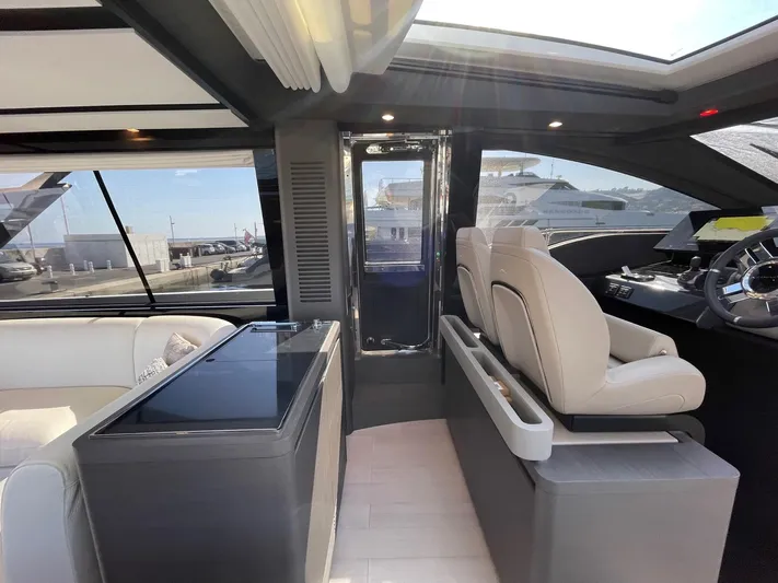  Yacht Photos Pics Luxurious interior of 2023 Azimut S8 yacht with modern seating and panoramic windows.