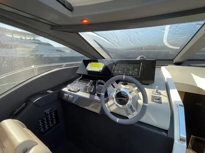  Yacht Photos Pics 2023 Azimut S8 yacht cockpit with modern steering and navigation controls.