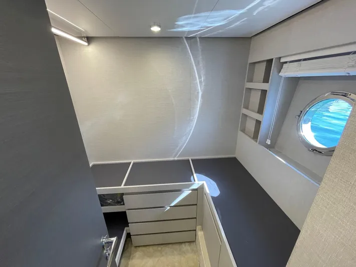  Yacht Photos Pics Interior of 2023 Azimut S8 yacht cabin with modern design and porthole window.