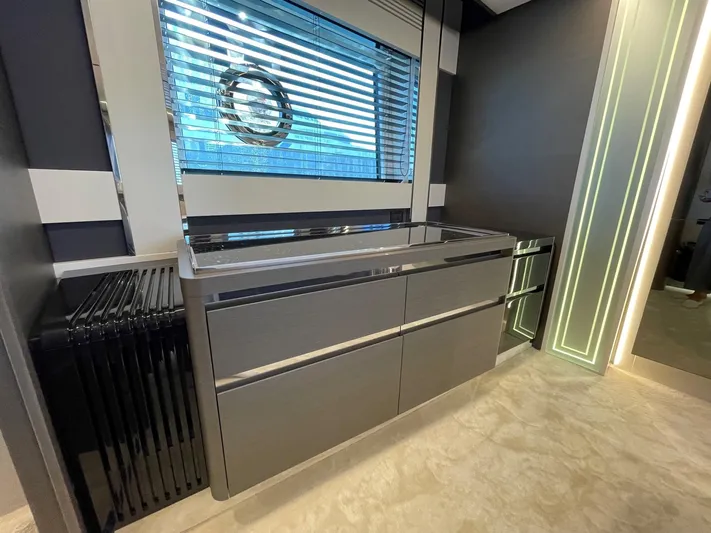  Yacht Photos Pics Modern interior of 2023 Azimut S8 yacht with sleek cabinetry and window blinds.