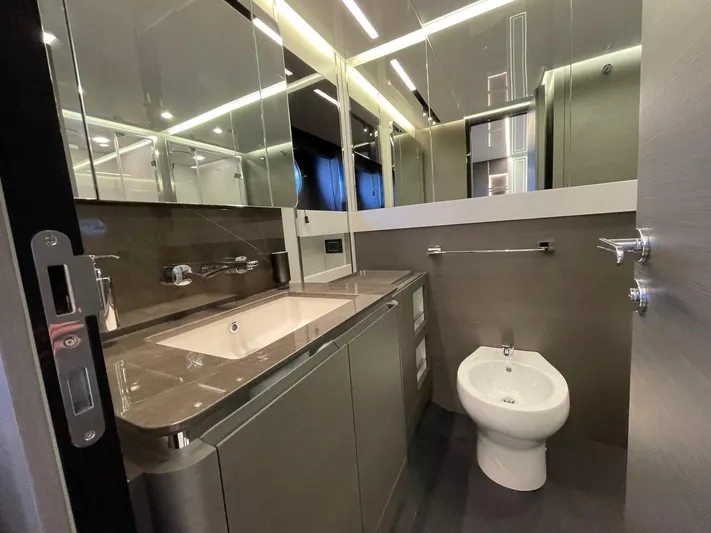  Yacht Photos Pics Luxurious bathroom in 2023 Azimut S8 yacht with modern fixtures and sleek design.