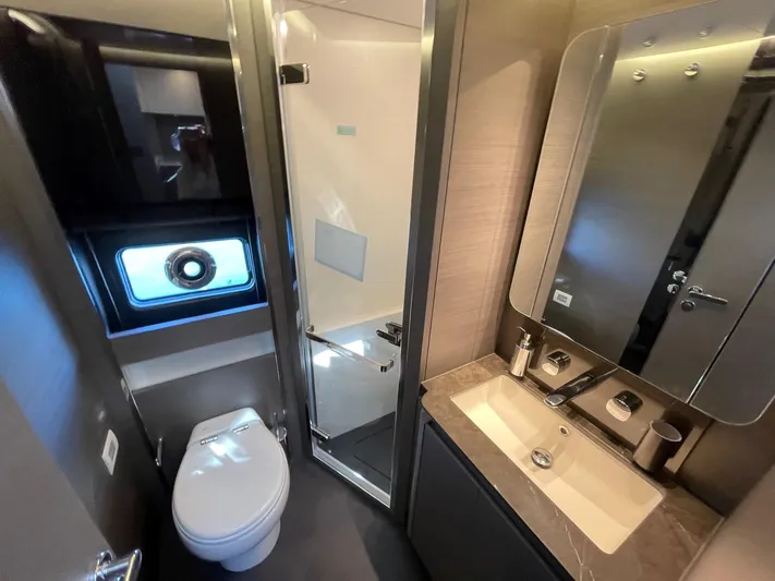  Yacht Photos Pics Luxurious bathroom in 2023 Azimut S8 yacht, featuring modern fixtures and elegant design.
