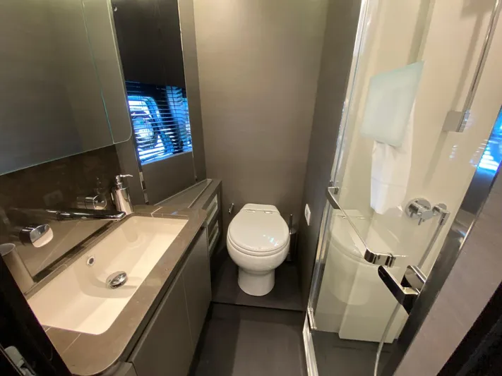  Yacht Photos Pics Luxurious bathroom in 2023 Azimut S8 yacht with modern fixtures and sleek design.