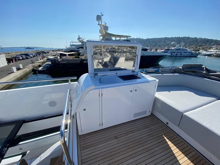  Yacht Photos Pics 2023 Azimut S8 yacht deck with seating and marina view.