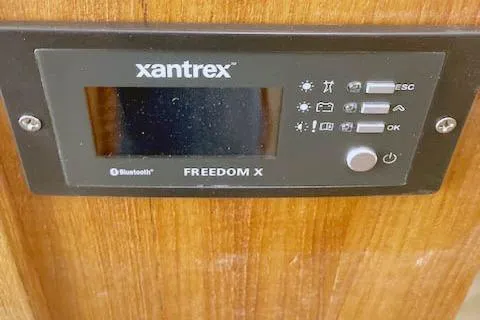 Tootles Yacht Photos Pics Xantrex Freedom X control panel on 2016 Ranger Tugs R-31 boat, featuring Bluetooth connectivity.