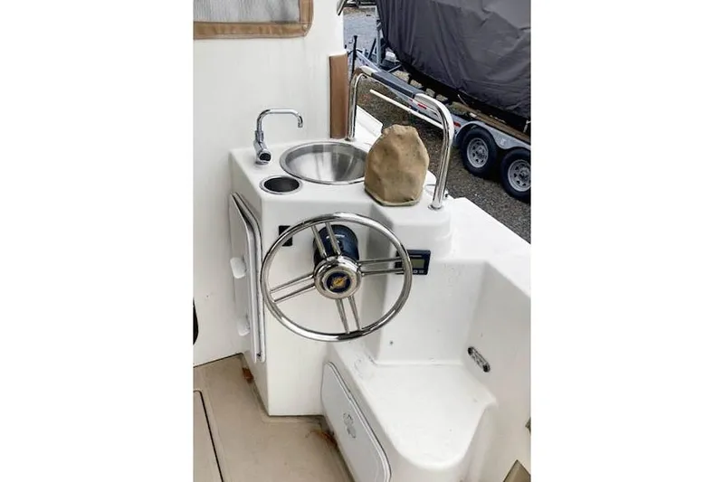 Tootles Yacht Photos Pics 2016 Ranger Tugs R-31 helm with sink and steering wheel.