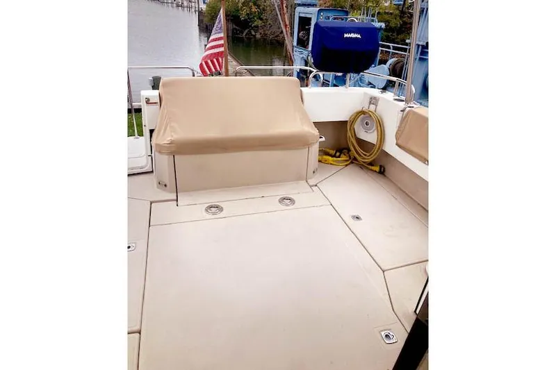 Tootles Yacht Photos Pics 2016 Ranger Tugs R-31 boat deck with seating and American flag.
