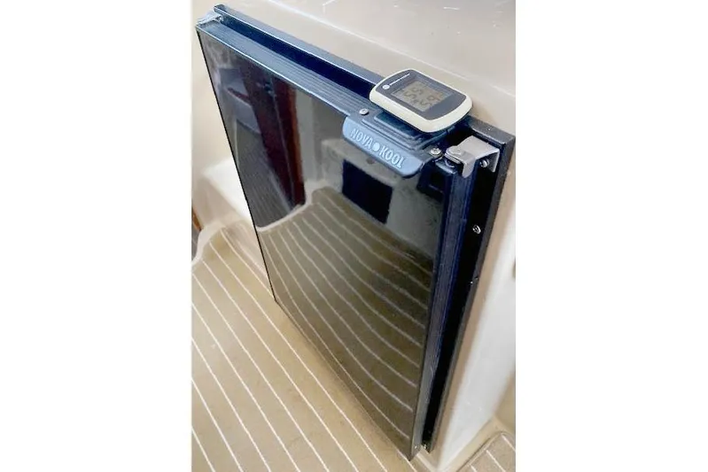 Tootles Yacht Photos Pics Nova Kool refrigerator on 2016 Ranger Tugs R-31 boat, with digital thermometer on top.