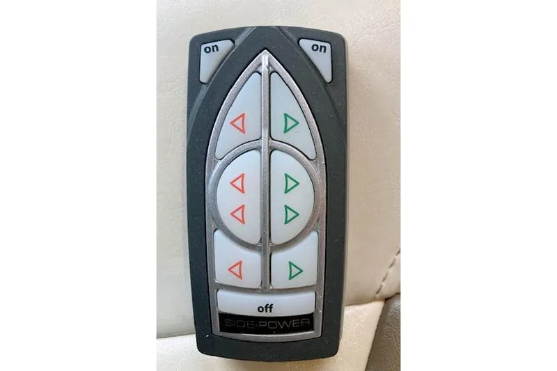Tootles Yacht Photos Pics Remote control for 2016 Ranger Tugs R-31, featuring directional buttons and "Side-Power" branding.