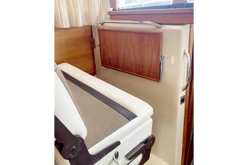 Tootles Yacht Photos Pics Interior seating and storage on 2016 Ranger Tugs R-31 boat, featuring wood accents.