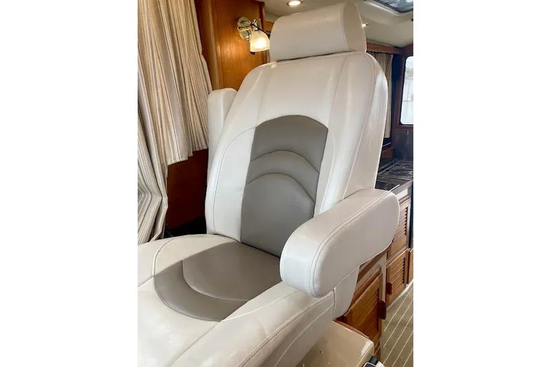 Tootles Yacht Photos Pics Luxurious captain's chair in 2016 Ranger Tugs R-31 boat interior.