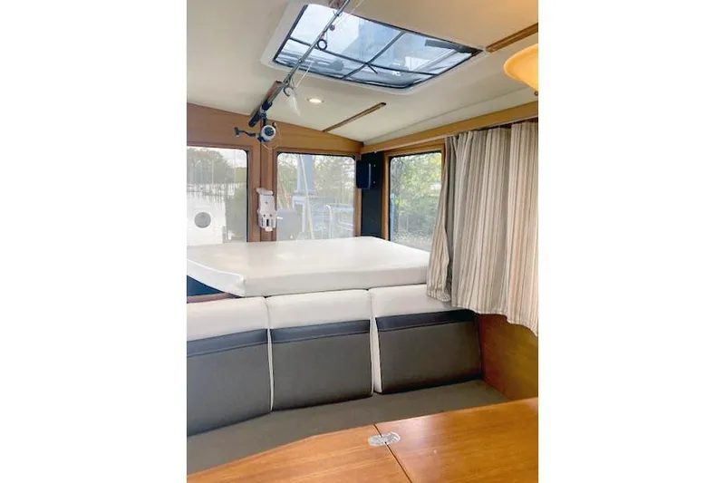Tootles Yacht Photos Pics Interior of 2016 Ranger Tugs R-31 boat with seating and skylight.