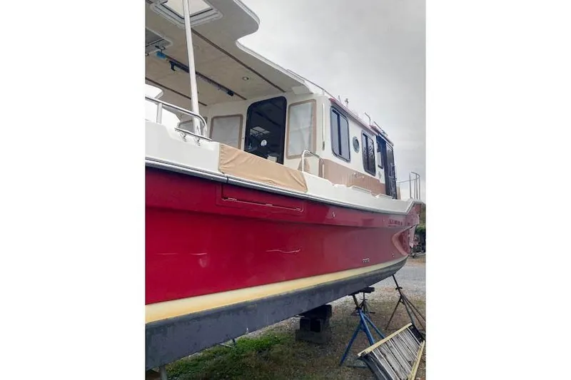 Tootles Yacht Photos Pics 2016 Ranger Tugs R-31 boat with red hull on dry dock.