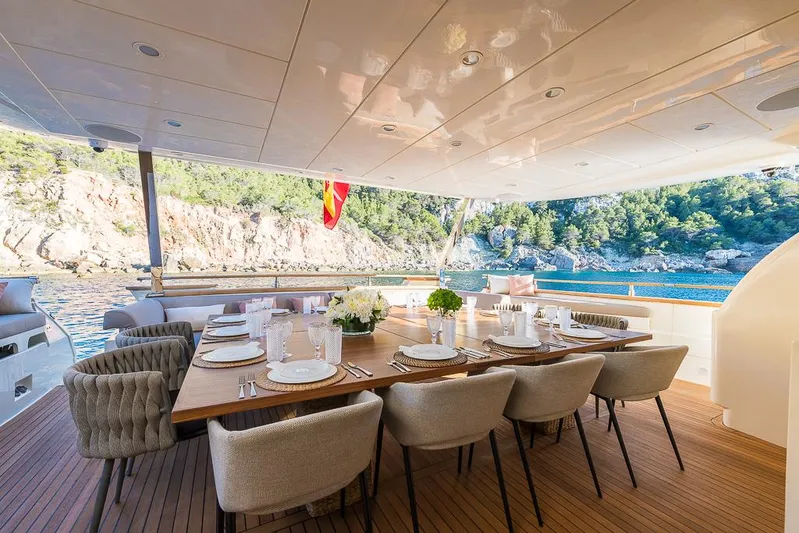  Yacht Photos Pics Luxurious dining area on 2005 Astondoa 102 GLX yacht with scenic ocean view.