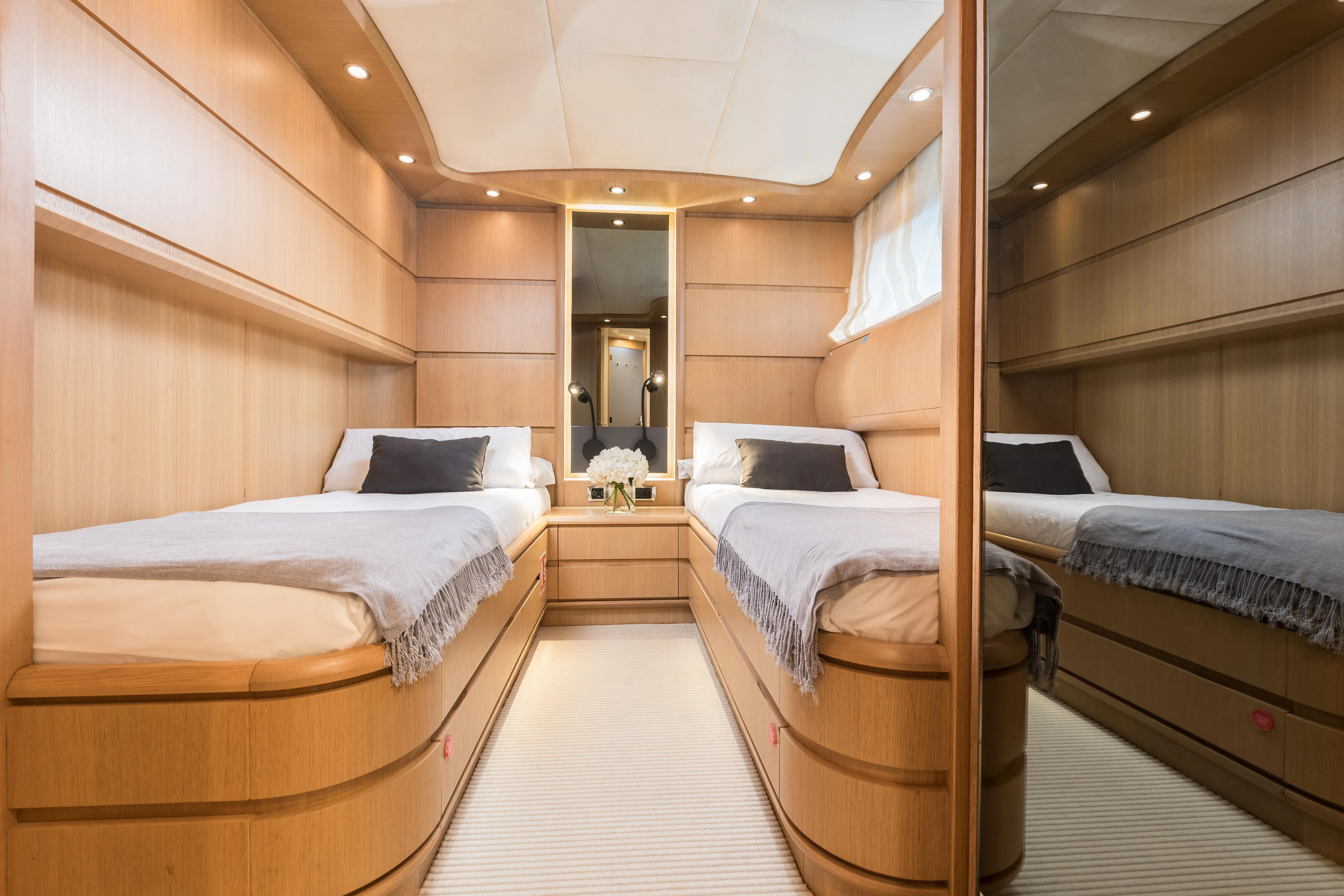  Yacht Photos Pics Luxurious twin cabin interior of 2005 Astondoa 102 GLX yacht, featuring elegant wood paneling.