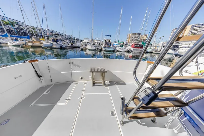 Honey Dew Yacht Photos Pics Sabre 34 Flybridge 2000 yacht deck with marina view, featuring stainless steel stairs.