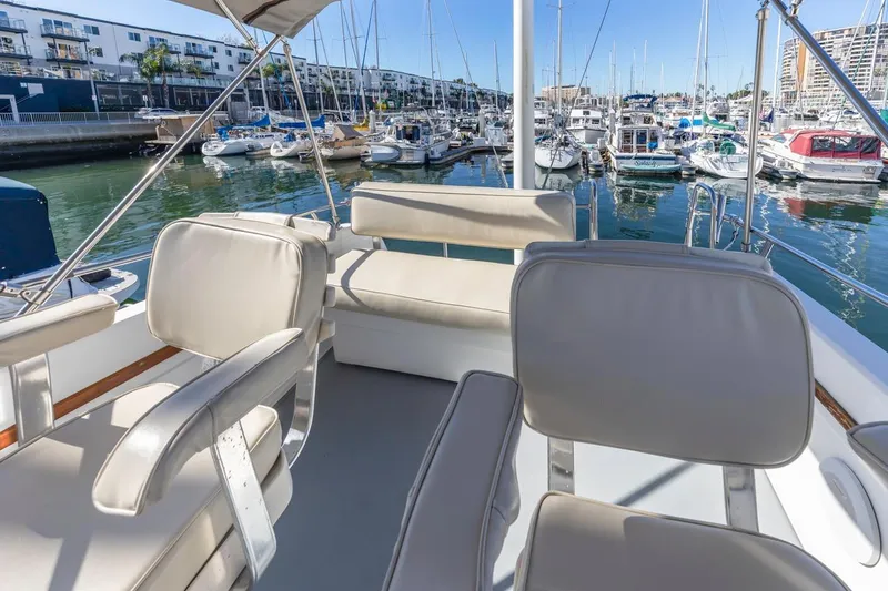 Honey Dew Yacht Photos Pics Flybridge view of 2000 Sabre 34 yacht in marina, featuring comfortable seating.