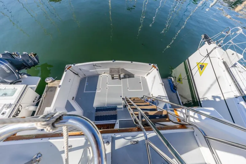 Honey Dew Yacht Photos Pics 2000 Sabre 34 Flybridge boat deck with water view and docked vessels.