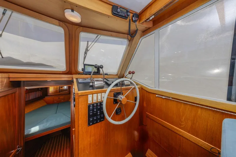 Honey Dew Yacht Photos Pics Interior of 2000 Sabre 34 Flybridge boat with wooden helm and steering wheel.