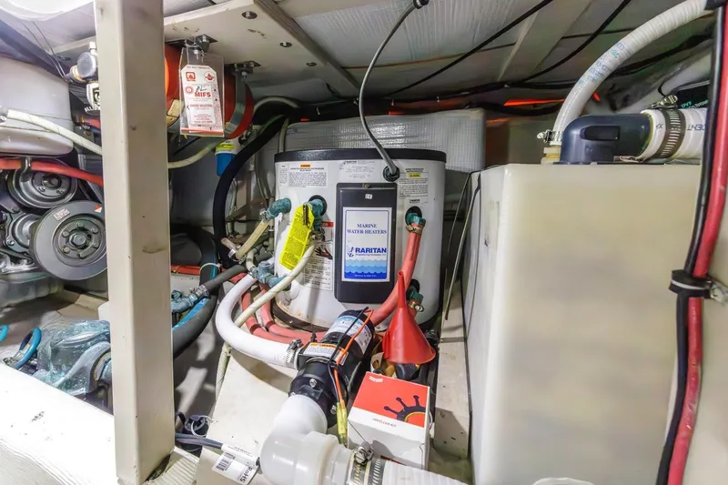 Honey Dew Yacht Photos Pics Engine room of 2000 Sabre 34 Flybridge with marine water heater and various components.