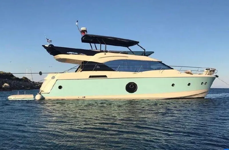 Anahita Yacht Photos Pics 2015 Beneteau Monte Carlo 6 yacht on calm water, side view.