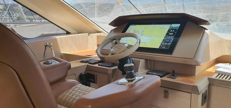 Anahita Yacht Photos Pics Luxurious helm of 2015 Beneteau Monte Carlo 6 yacht with advanced navigation system.