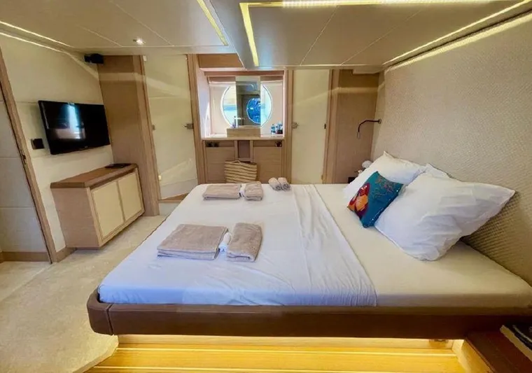 Anahita Yacht Photos Pics Luxurious bedroom interior of 2015 Beneteau Monte Carlo 6 yacht with modern amenities.