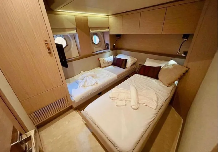 Anahita Yacht Photos Pics Luxurious cabin interior of 2015 Beneteau Monte Carlo 6 yacht with twin beds.