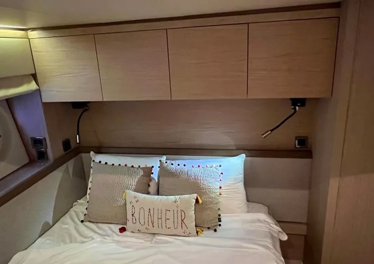 Anahita Yacht Photos Pics Luxurious cabin interior of 2015 Beneteau Monte Carlo 6 yacht with cozy bedding.