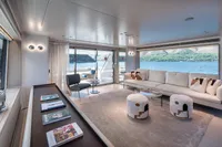 Luxurious interior of 2023 Custom Line Navetta 30 yacht with elegant seating and scenic views.