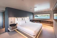 Luxurious bedroom interior of 2023 Custom Line Navetta 30 yacht with ocean view.