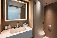 Luxurious bathroom interior on 2023 Custom Line Navetta 30 yacht, featuring modern fixtures and elegant design.