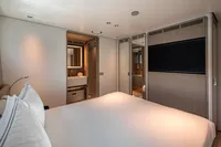 Luxurious bedroom interior of 2023 Custom Line Navetta 30 yacht, featuring modern design and amenities.