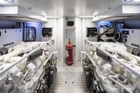Engine room of 2023 Custom Line Navetta 30 yacht with Kohler generators and fire extinguisher.
