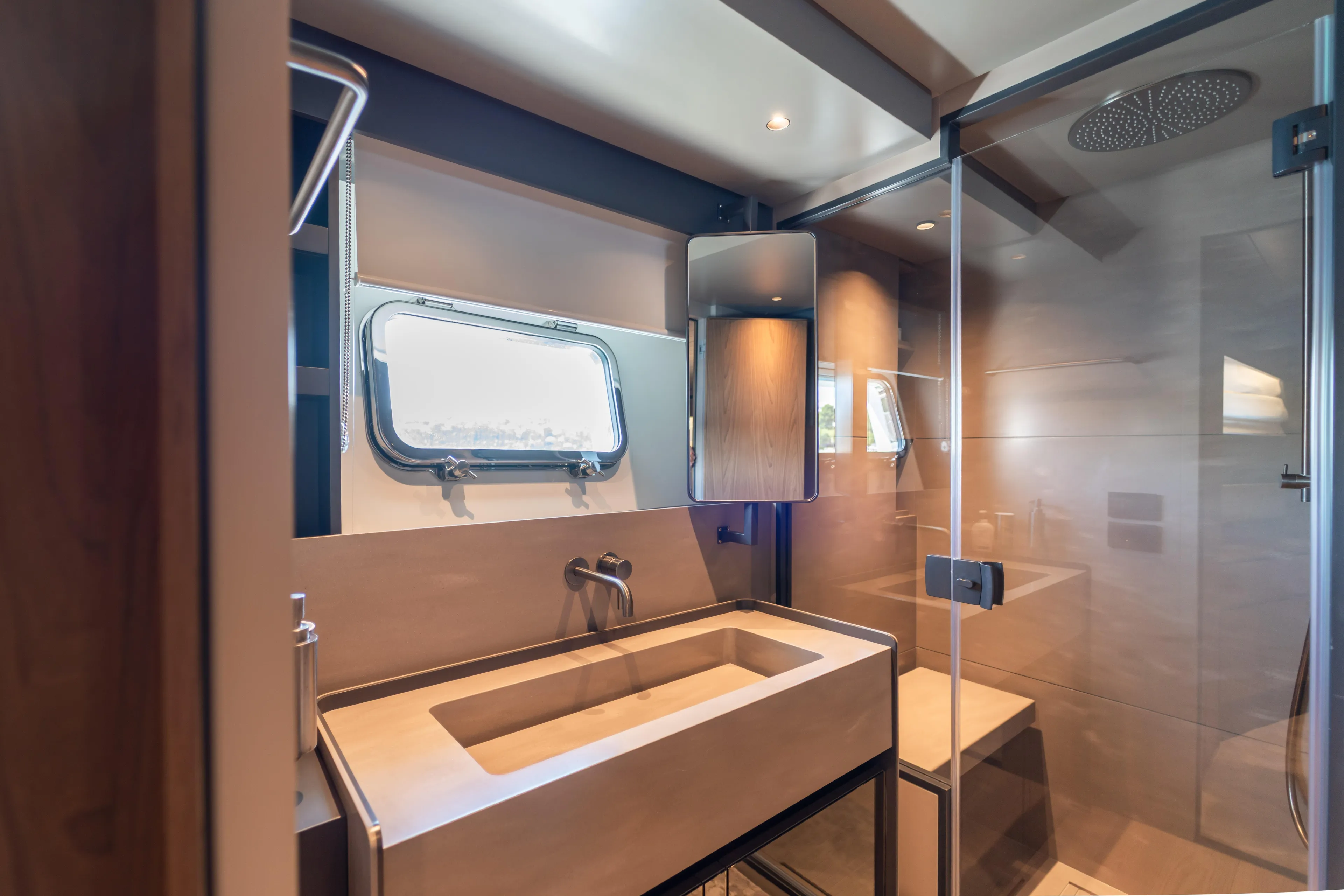  Yacht Photos Pics Luxurious bathroom interior of 2025 Bluegame BG74 yacht with modern fixtures and glass shower.