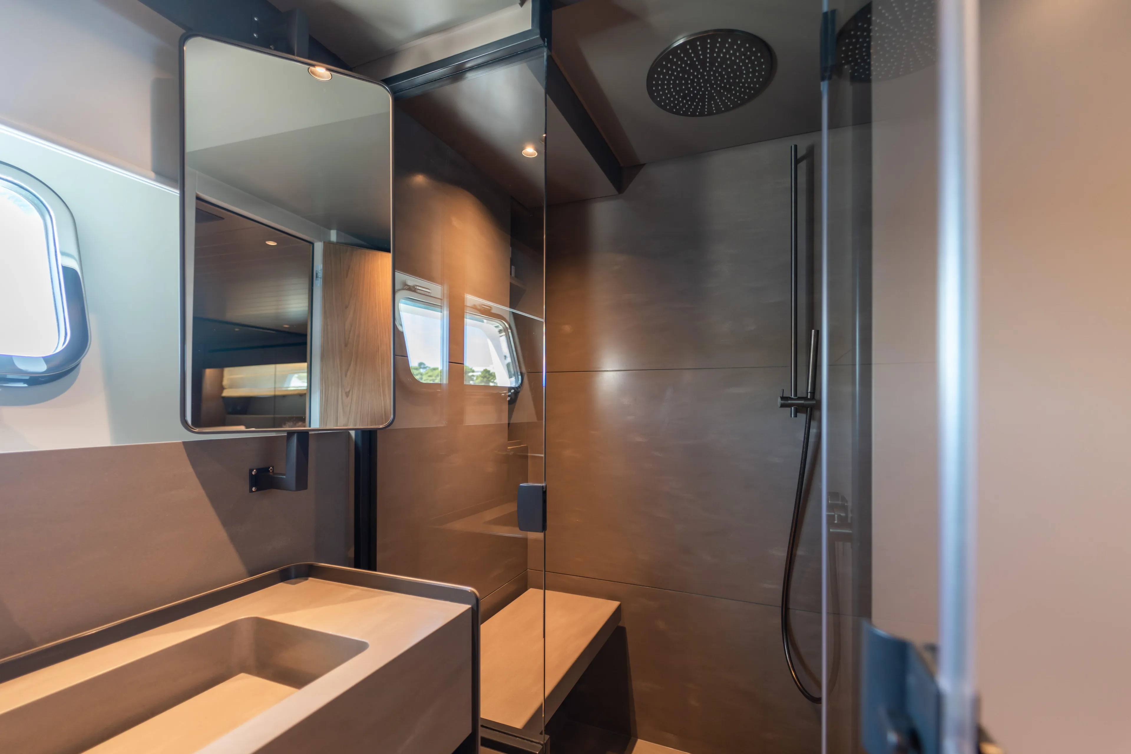 Yacht Photos Pics Luxurious bathroom interior of 2025 Bluegame BG74 yacht with modern fixtures and sleek design.