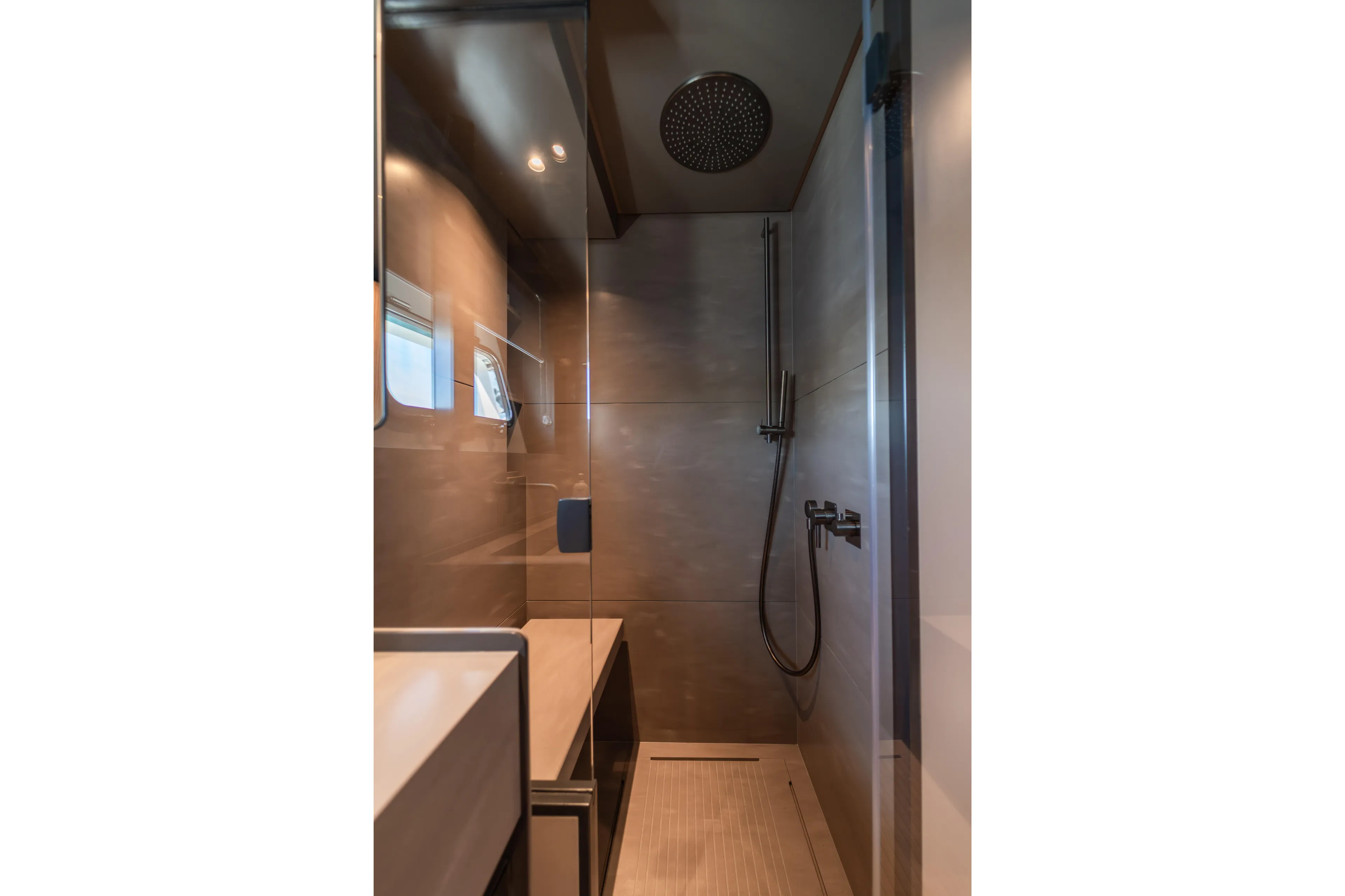  Yacht Photos Pics Modern shower in 2025 Bluegame BG74 yacht, featuring sleek design and high-end fixtures.
