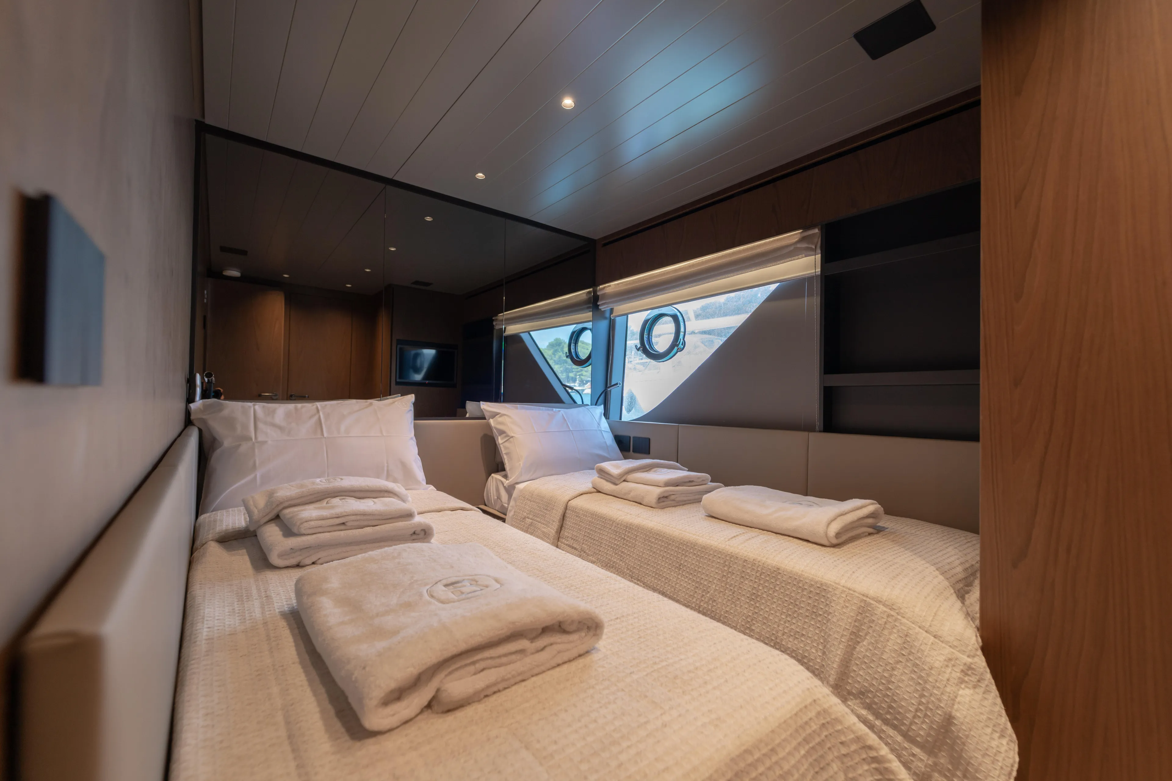  Yacht Photos Pics Luxurious cabin interior of 2025 Bluegame BG74 yacht with twin beds and elegant decor.