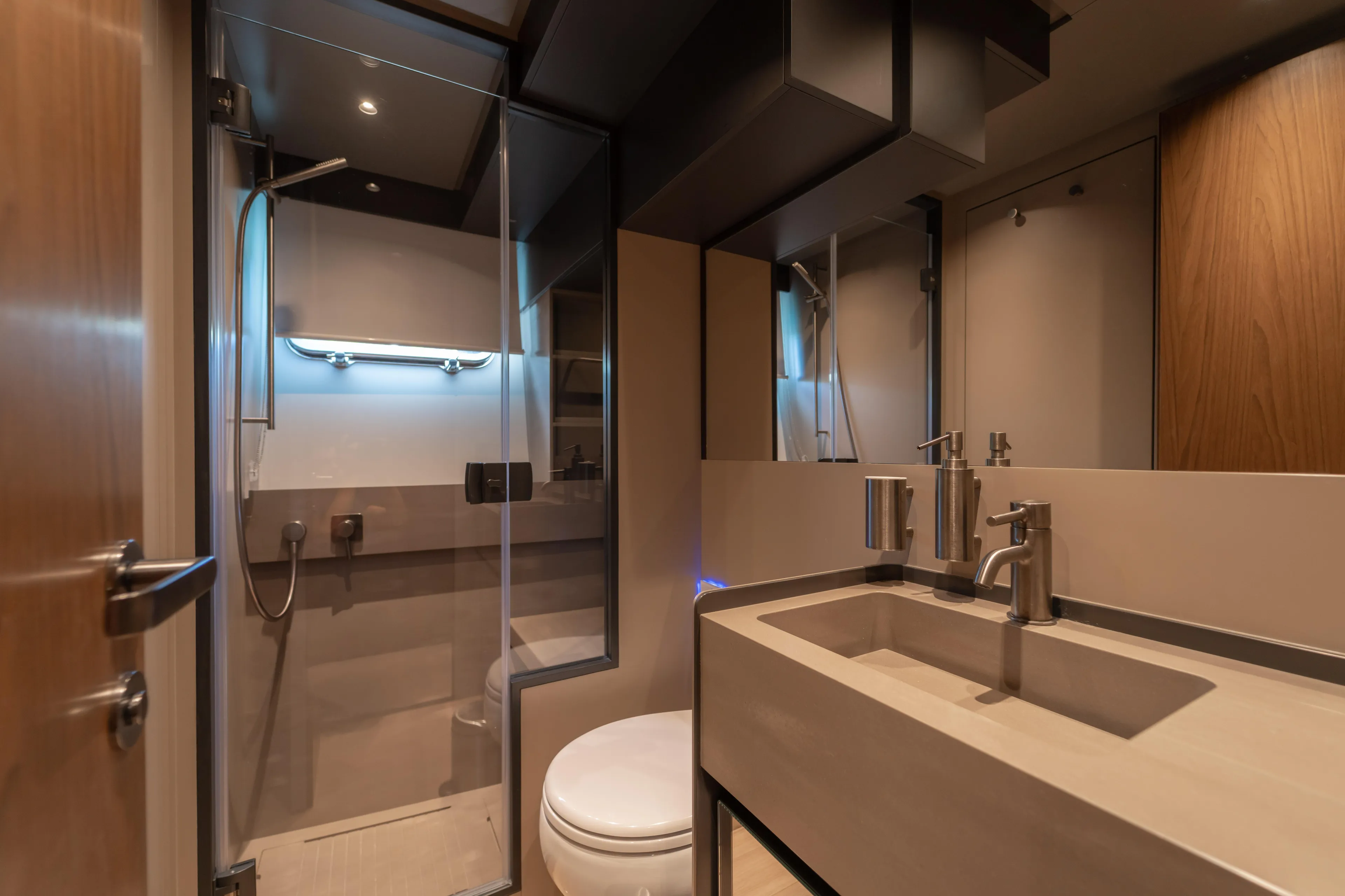  Yacht Photos Pics Luxurious bathroom interior of 2025 Bluegame BG74 yacht, featuring modern fixtures and elegant design.