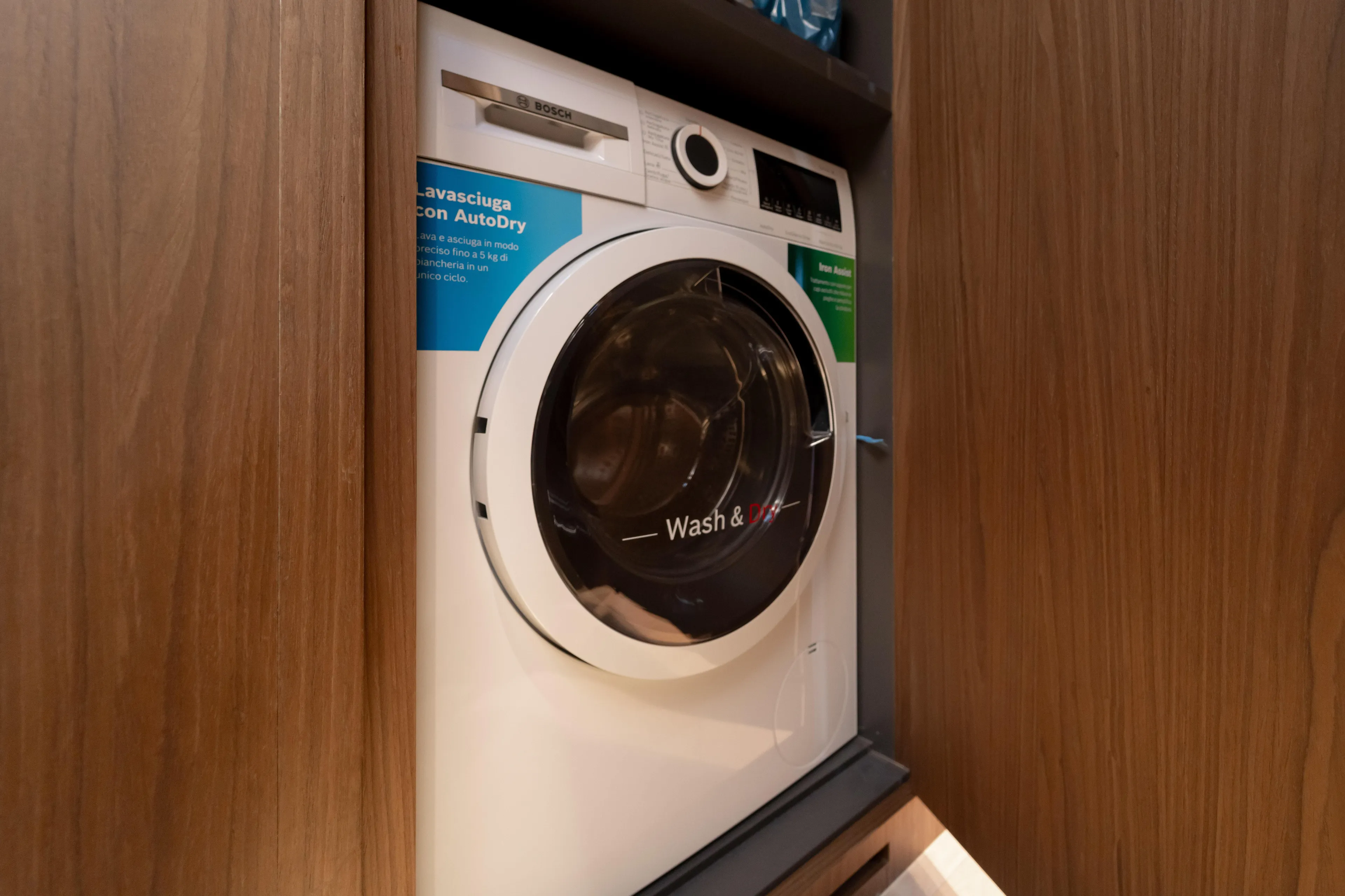 Yacht Photos Pics Washing machine in Bluegame BG74 yacht, 2025 model, integrated in wooden cabinet.